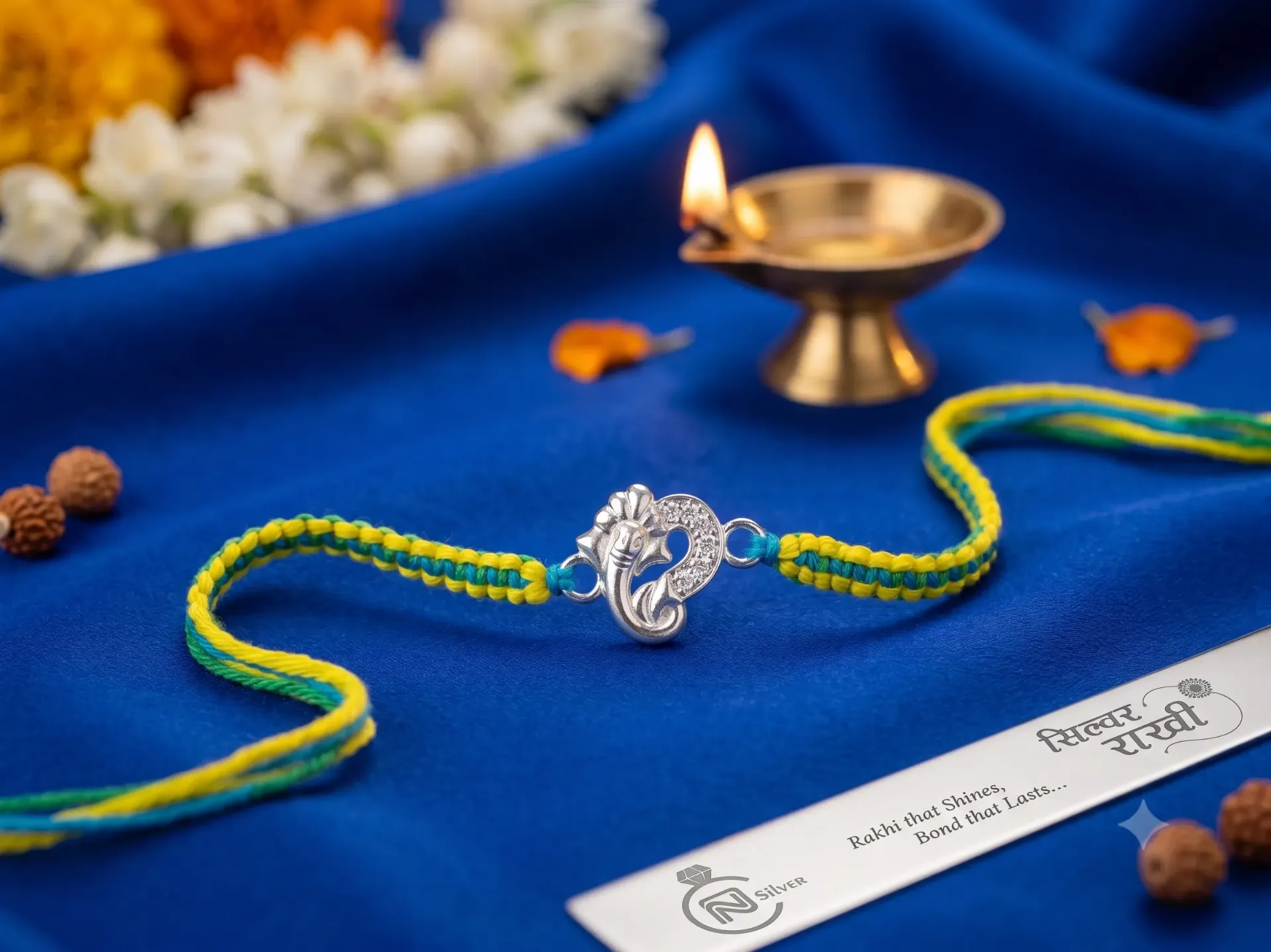 Silver Clear Zirconia Rakhi Bracelet with Ganesha Centerpiece